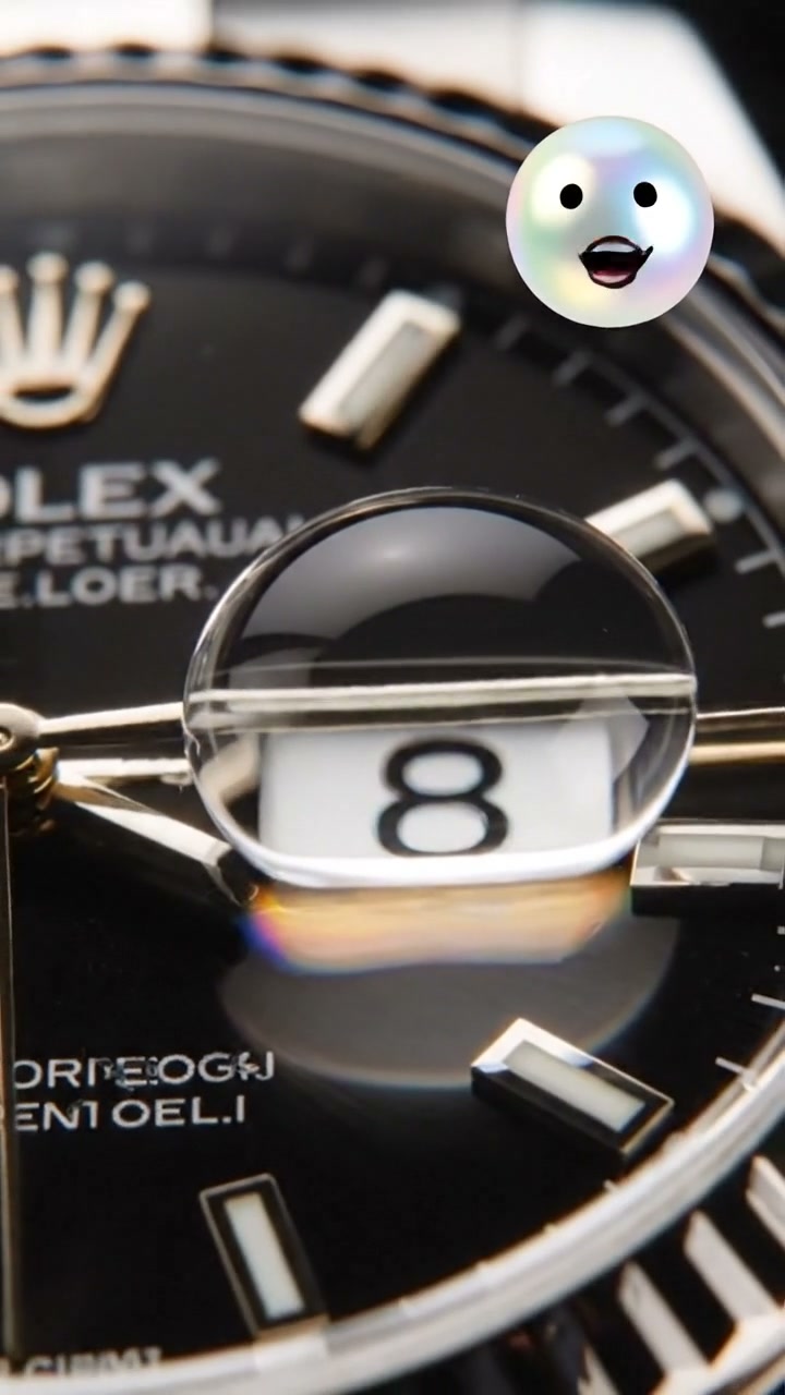 The tiny magnifying glass on the dial